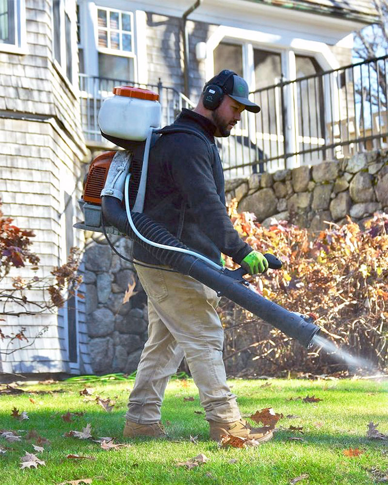 A Pure Solutions tech applying a mosquito control spray last fall in Connecticut